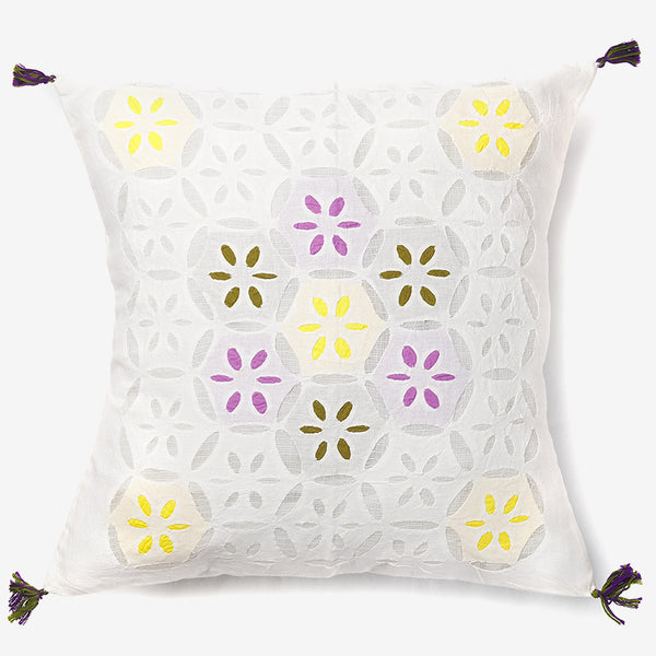 front of a white luxury cushion cover with multicolour leaves