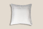 back of an Exclusive white silk cushion with golden peacock zardozi embroidery