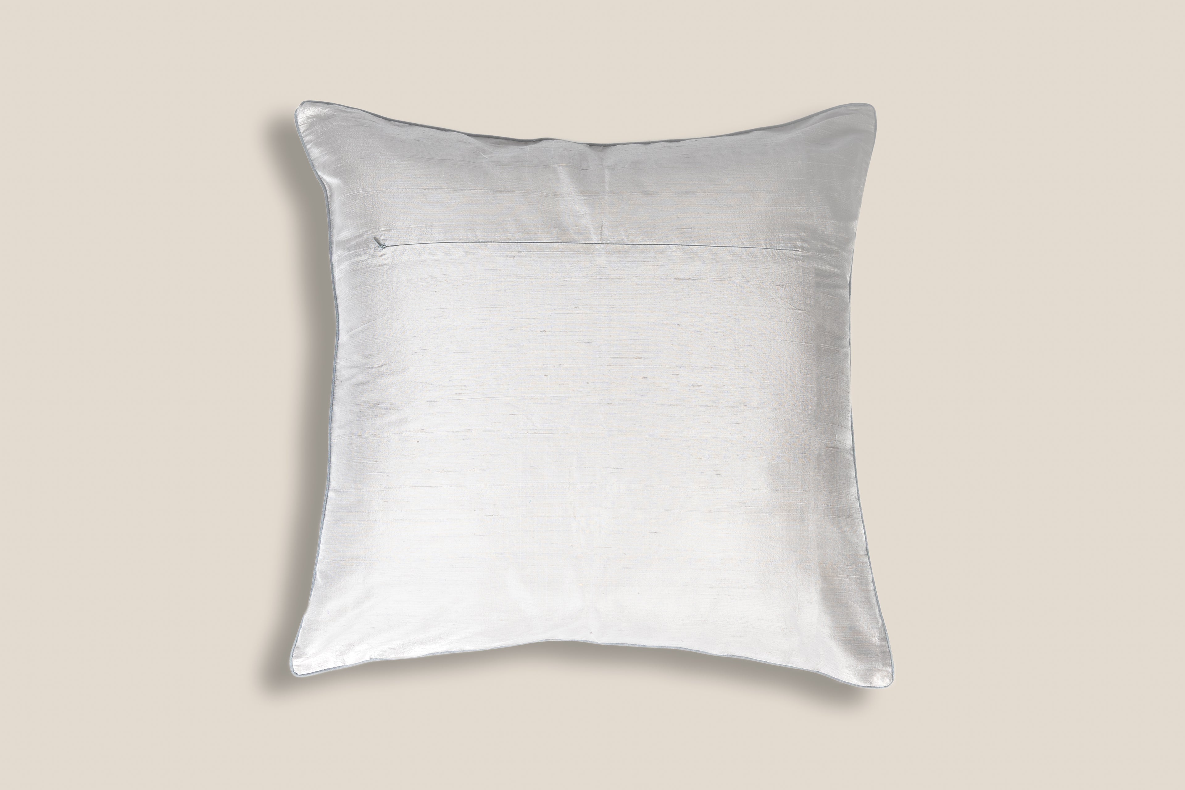 back of an Exclusive white silk cushion with golden peacock zardozi embroidery