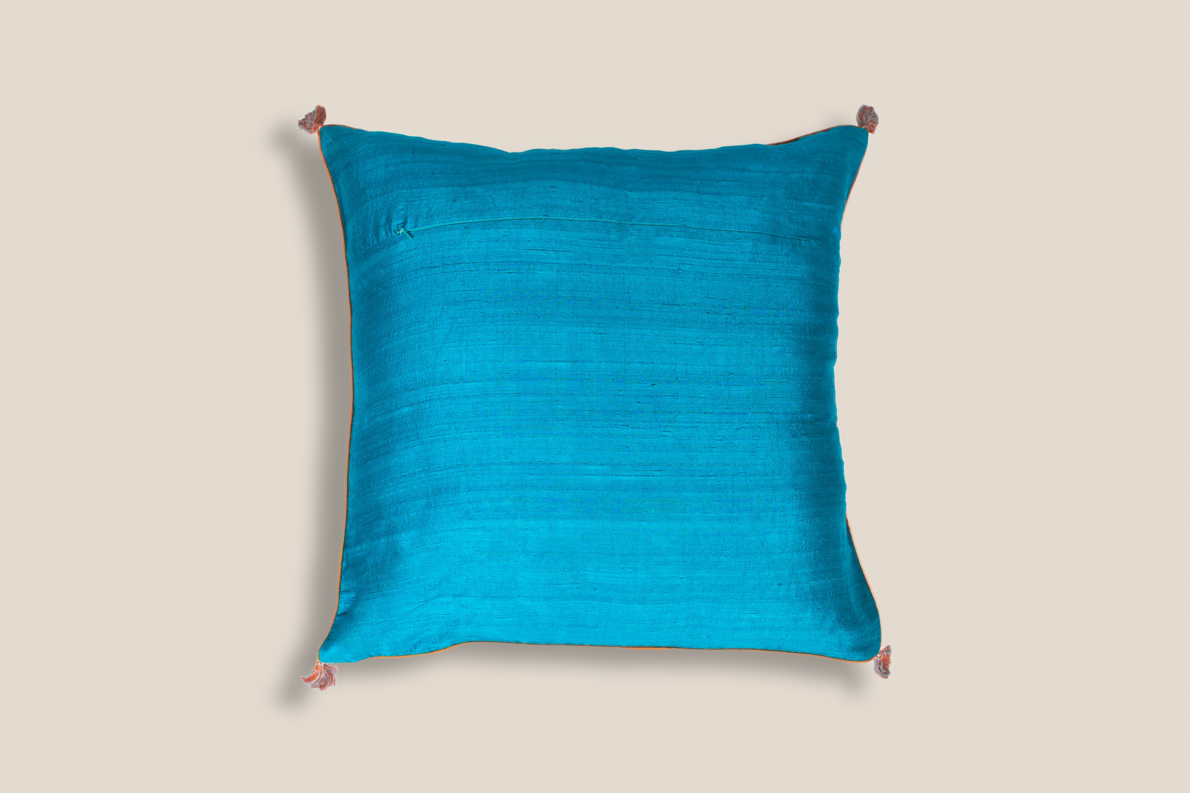 back of an Exclusive ocean silk cushion with  tassels