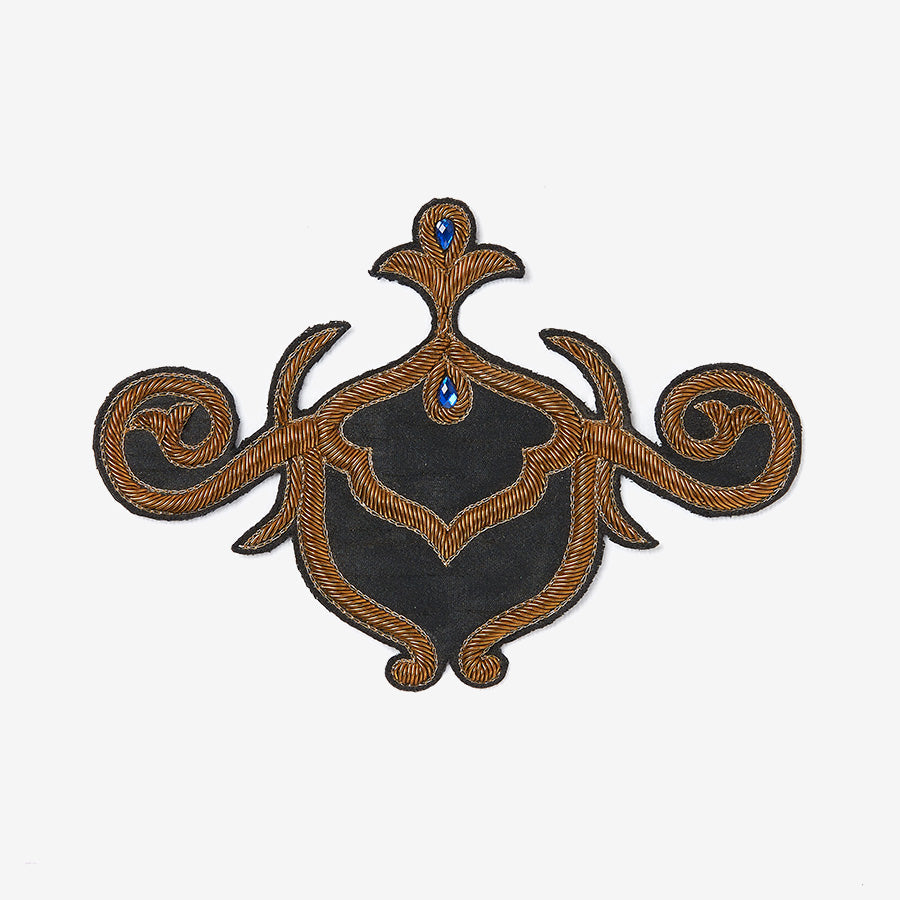 Golden embroidered patch with blue stone