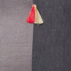 Grey and black silk and linen luxury cushion with a tassel