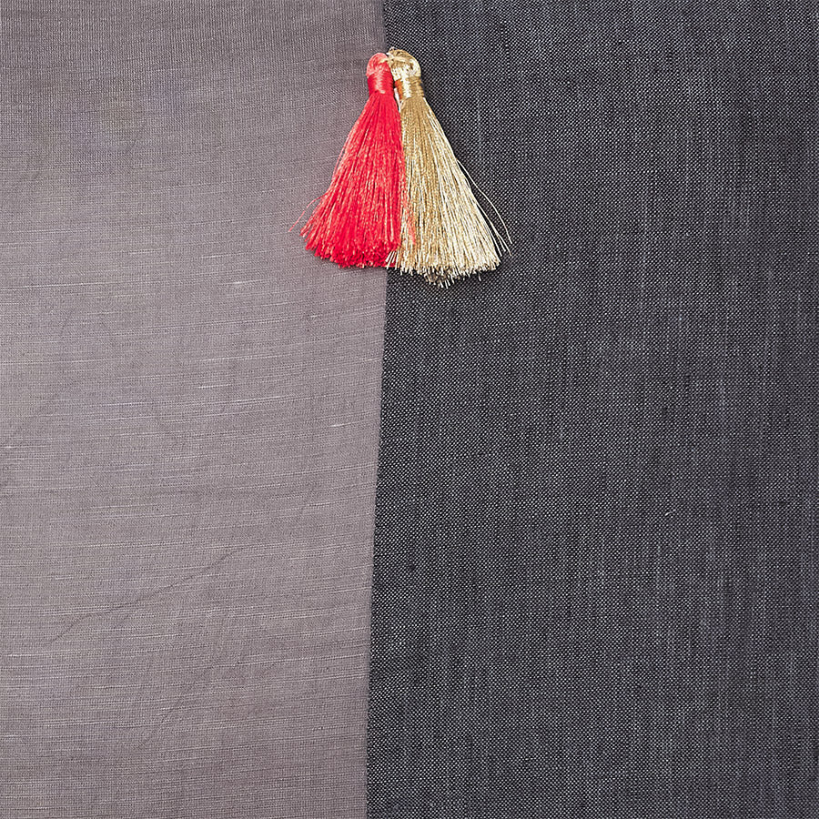 Grey and black silk and linen luxury cushion with a tassel