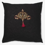 front of a Black linen luxury cushion with zardozi motifs, beads & tassel