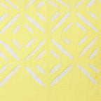 detail of a yellow luxury cushion cover